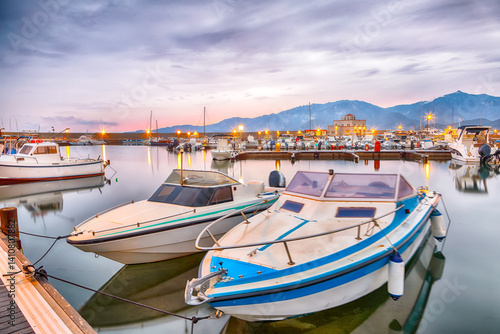 Remarkable  sunset view on boats in beautiful marina of Villasimius.