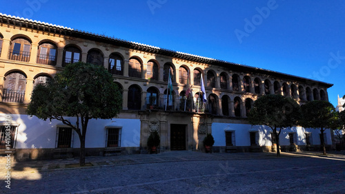 Town Hall of Ronda displaying andalusian architecture under blue sky