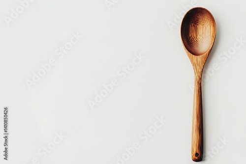 Obraz na płótnie A minimalist wooden spoon isolated on a white background, perfect for kitchen utensil photography w salonie