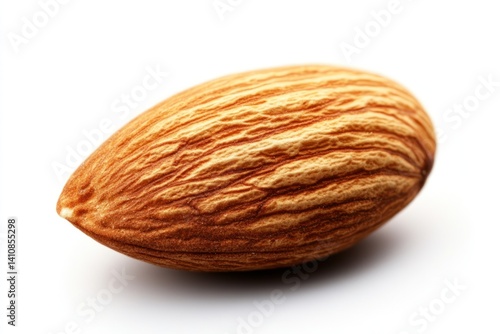 Obraz na płótnie A single almond nut, captured in stunning close-up, isolated on a white background to highlight its texture and detail w salonie