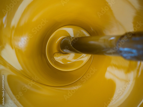 Inside a yellow paint mixer, you can see how environmentally friendly paints are mixed.