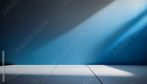 Empty gray and blue background for product presentation with light and shadow on the wall and floor