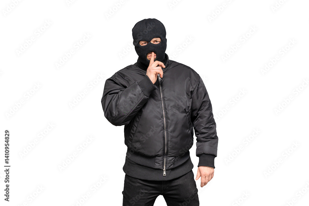 Masked man gesturing silence with finger on lips Masked man gesturing silence with finger on lips