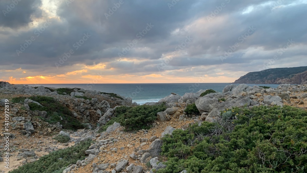 Dramatic rocky coastline at sunset with cloudy sky, perfect for nature exploration, summer vacations, coastal holiday retreats Dramatic rocky coastline at sunset with cloudy sky, perfect for nature exploration, summer vacations, coastal holiday retreats