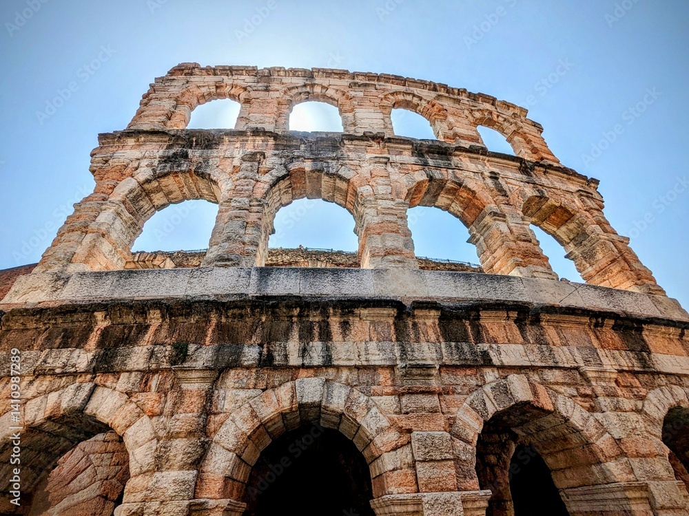 Obraz premium Facade of ancient colosseum on a beautiful sunny day in Verona Italy.