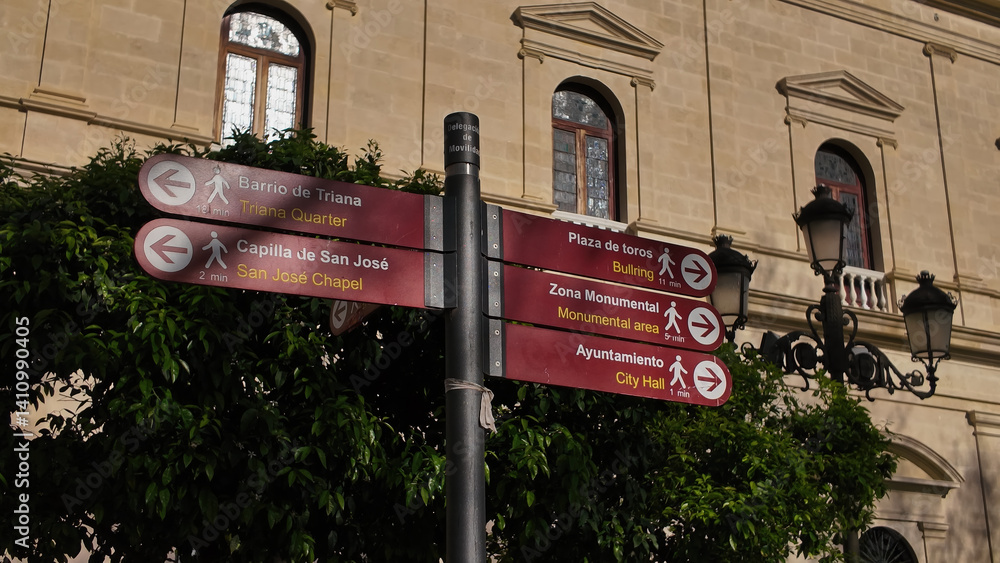 Naklejka premium Street signs showing directions to Triana, San Jose Chapel, Bullring and City Hall in Seville, Spain