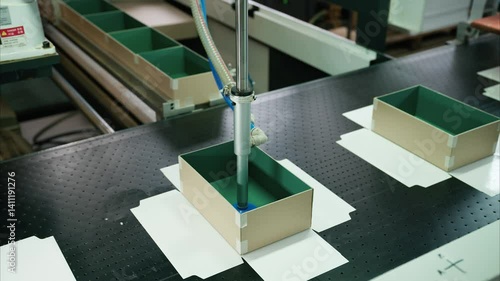 Innovative robot-driven cardboard box gluing process in a state-of-the-art manufacturing plant