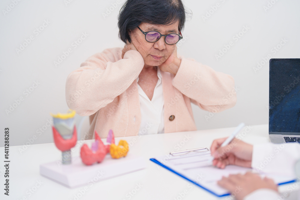 Elderly Patient having Neck pain and consulting with Doctor to Thyroid disease. Anatomy Thyroid model for Hyperthyroidism, Hypothyroidism, Hashimoto Thyroiditis, Thyroid Tumor and Cancer Elderly Patient having Neck pain and consulting with Doctor to Thyroid disease. Anatomy Thyroid model for Hyperthyroidism, Hypothyroidism, Hashimoto Thyroiditis, Thyroid Tumor and Cancer