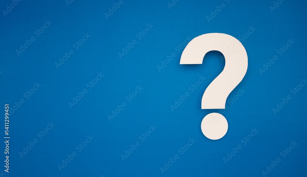 White question mark on bright blue background symbolizing confusion, FAQ, inquiry or curiosity White question mark on bright blue background symbolizing confusion, FAQ, inquiry or curiosity