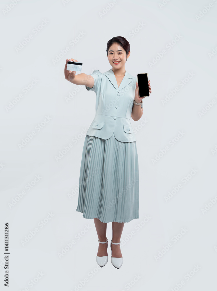 Young woman with bank card and phone ready for digital purchases or online banking operations Young woman with bank card and phone ready for digital purchases or online banking operations