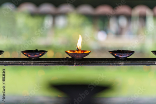 Obraz na płótnie The image showcases the Temple of the Sacred Tooth Relic in Kandy, Sri Lanka, a revered Buddhist site housing Buddha’s tooth relic, featuring traditional architecture and cultural significance. w salonie