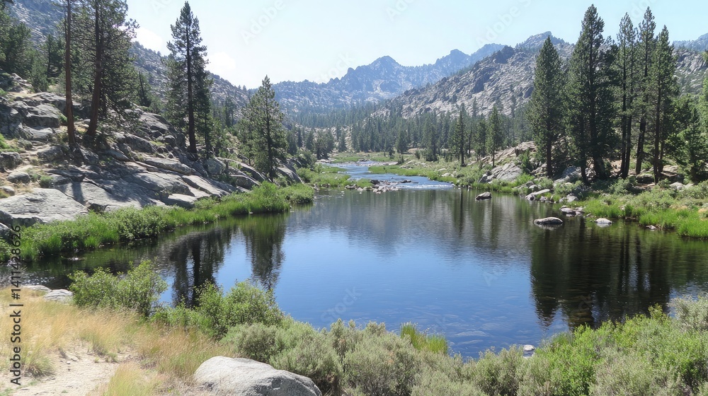 Fototapeta premium High-resolution image of a peaceful river valley reflecting granite mountains with trees along the riverbanks
