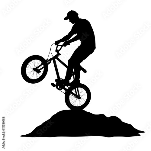 Biker performing a stunt on a dirt mound