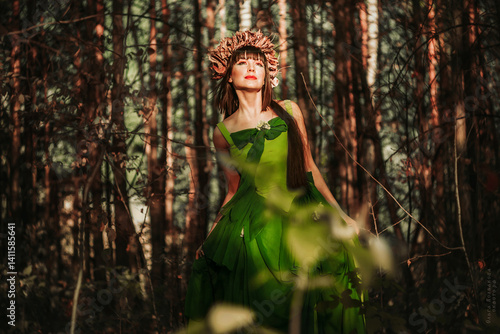Beautiful girl in a dress in the forest