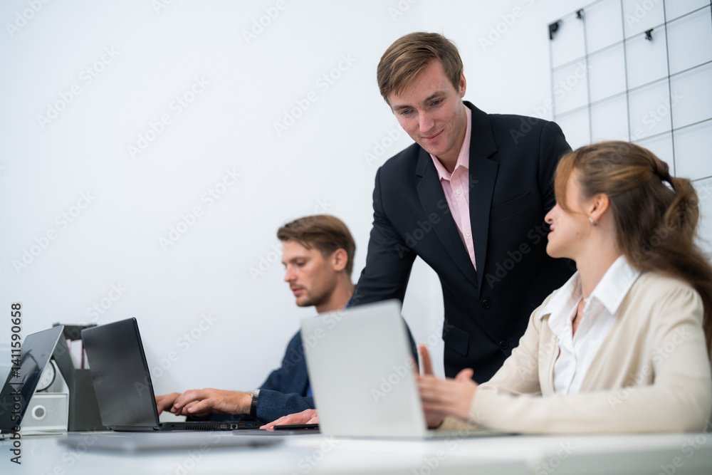 Business collaboration occurs in a modern office setting with professionals engaged in discussion and work Business collaboration occurs in a modern office setting with professionals engaged in discussion and work