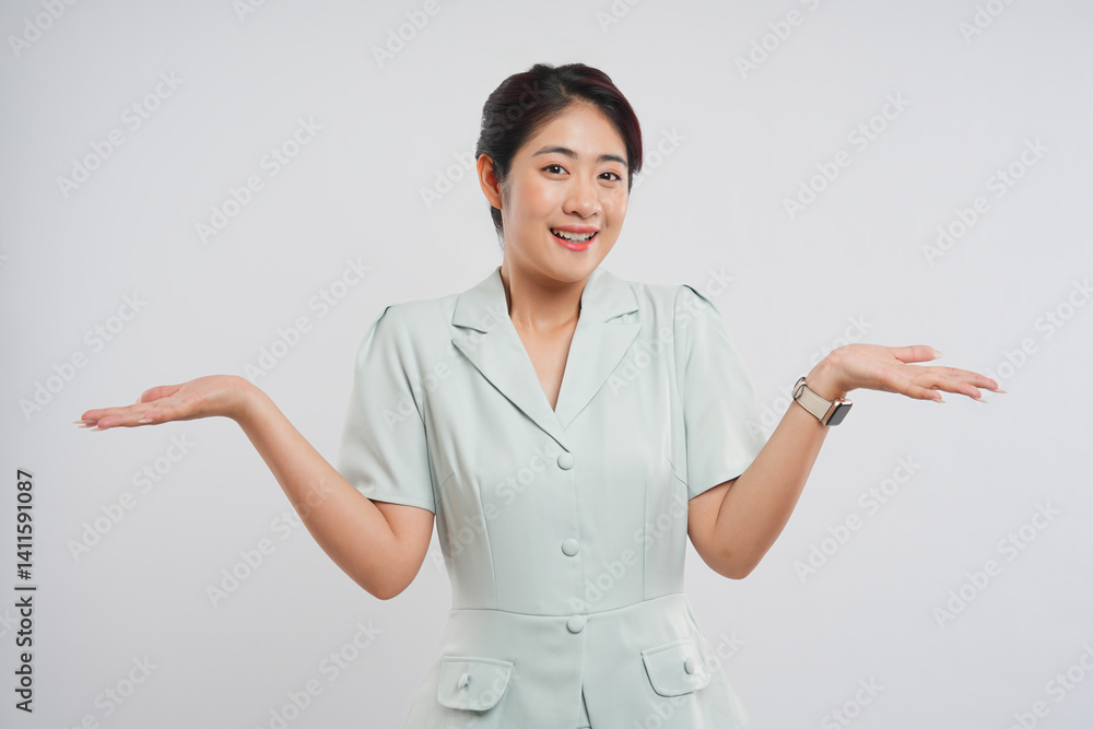 Smiling woman presenting with open palms isolated on white Modern pale green dress Smiling woman presenting with open palms isolated on white Modern pale green dress