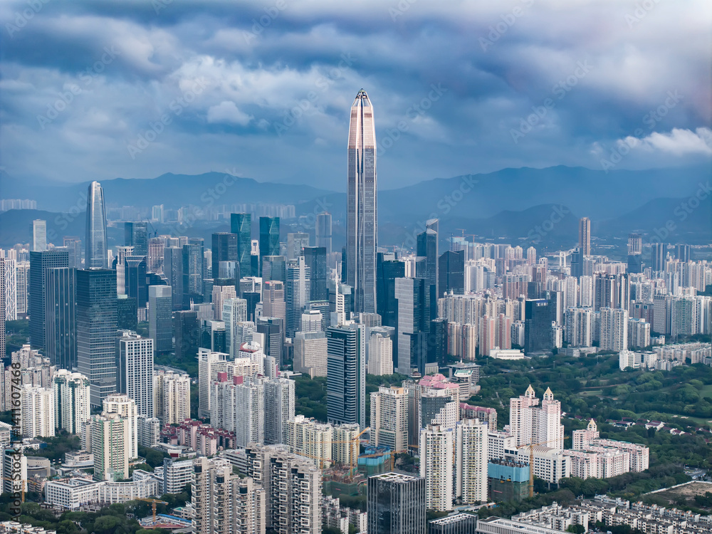 Naklejka premium Shenzhen skyline cityscape with skyscrapers in downtown at sunset twilight in Shenzhen, China