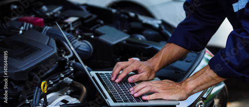Mechanic in work gloves repairs car engine in auto repair shop. Auto mechanic checks vehicle with wrench, fixes issues. Car service, maintenance, engine diagnostic, automotive repair.