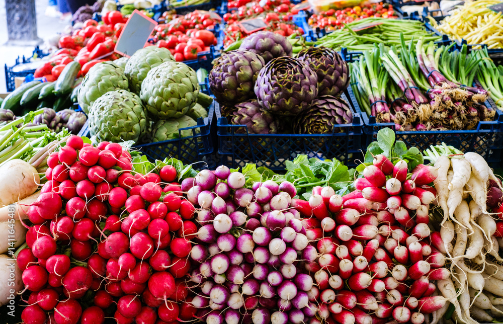 Vibrant display of fresh vegetables at a bustling market in spring showcasing local produce and agricultural abundance