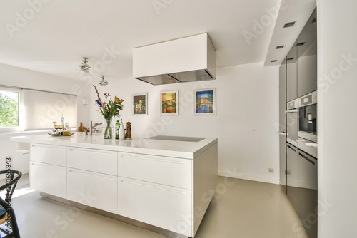 Wallpaper Mural A sleek and contemporary kitchen featuring clean lines, a spacious island, and stylish decor elements. The bright space emphasizes functionality and aesthetics. Torontodigital.ca