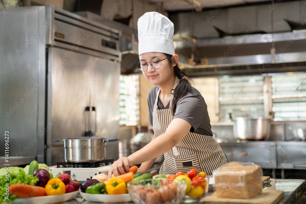 A female chef broadcasts her cooking knowledge live on a social media app on her mobile phone. A female chef broadcasts her cooking knowledge live on a social media app on her mobile phone.