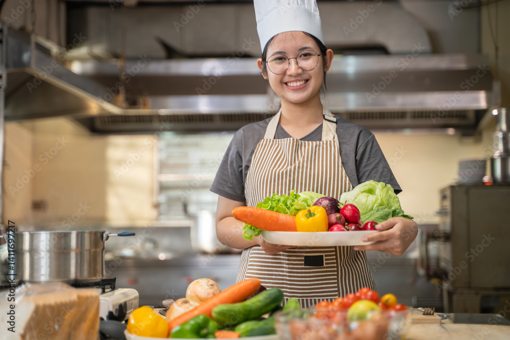 A female chef broadcasts her cooking knowledge live on a social media app on her mobile phone. A female chef broadcasts her cooking knowledge live on a social media app on her mobile phone.