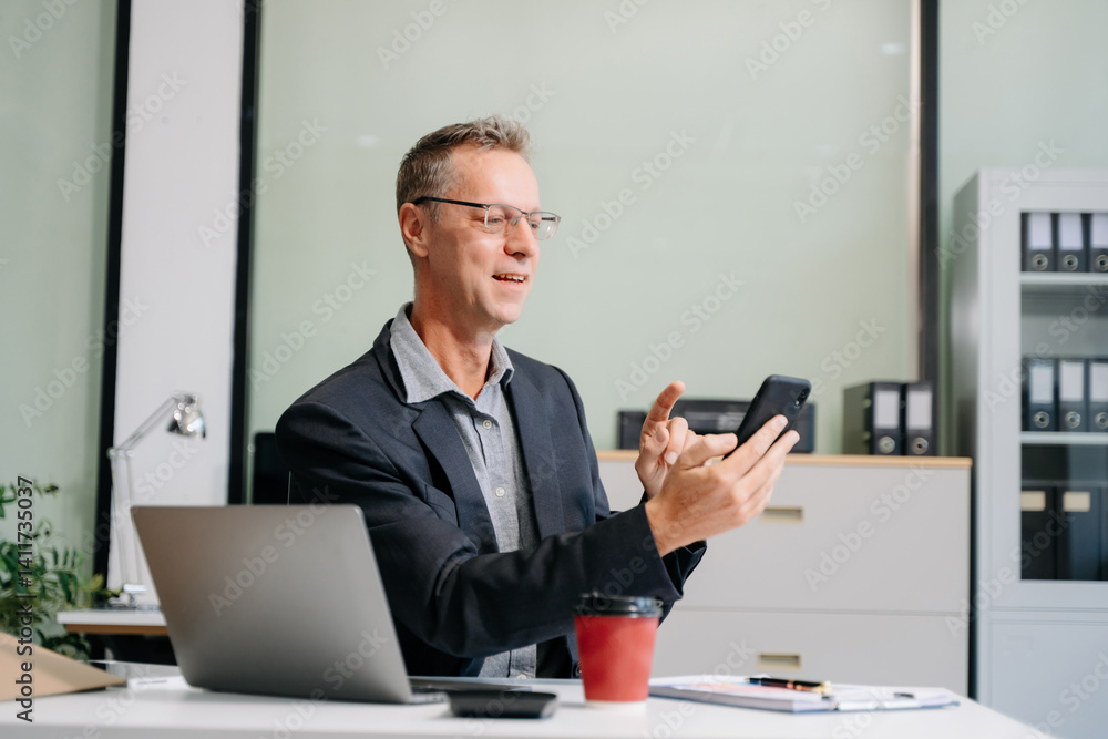 Professional businessman working at office with laptop, tablet, and notes. Perfect for business, finance, accounting Professional businessman working at office with laptop, tablet, and notes. Perfect for business, finance, accounting
