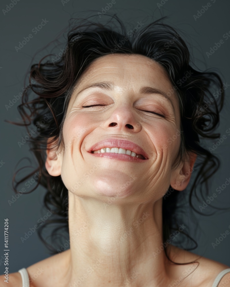 Radiant mature woman smiling with closed eyes showcasing natural skincare results in studio Radiant mature woman smiling with closed eyes showcasing natural skincare results in studio