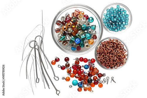 Colorful assortment of beads and jewelry-making tools arranged on a crafting table for creative projects and artistic expression isolated on transparent background