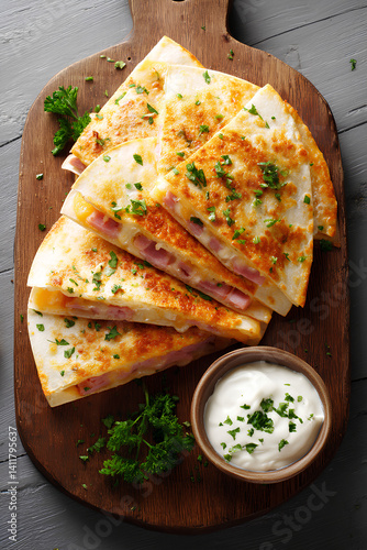 Crispy ham and cheddar quesadilla with parmesan crust and creamy carbonara sauce offering a rich flavorful twist on a classic Mexican style snack
