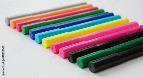 Colorful Marker Pens Arranged in Row on White Background for Art Projects