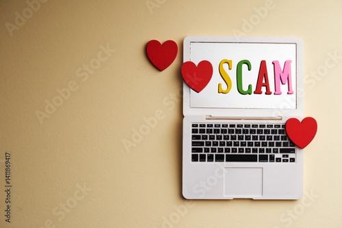 red heart shape and miniature laptop