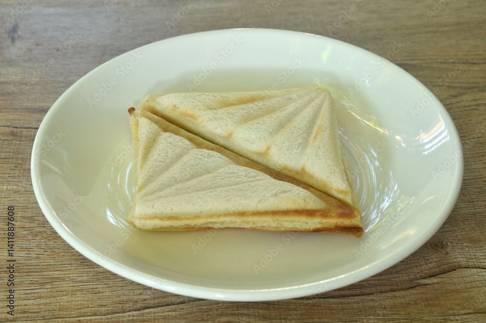 baking sandwich stuffing ham and cheese arraning on plate