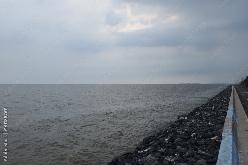 landscape of sea on sunset with rain cloud coming