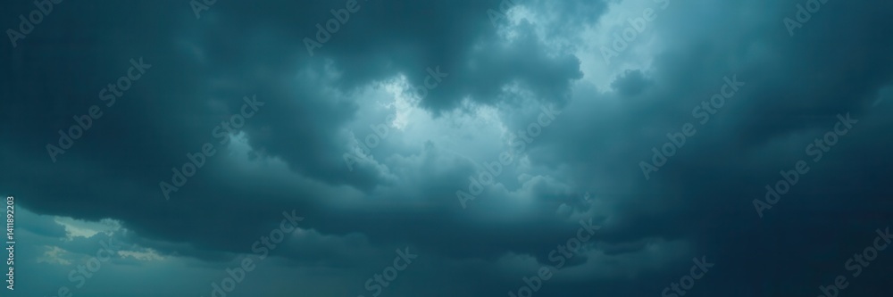 Obraz premium Dense, grey storm clouds gather ominously overhead , weather, scenic