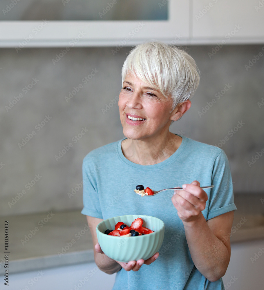 kitchen food woman healthy morning mature breakfast active fitness diet home healthy eating senior adult healthy lifestyle fruit sport fit health eating preparation nutrition female