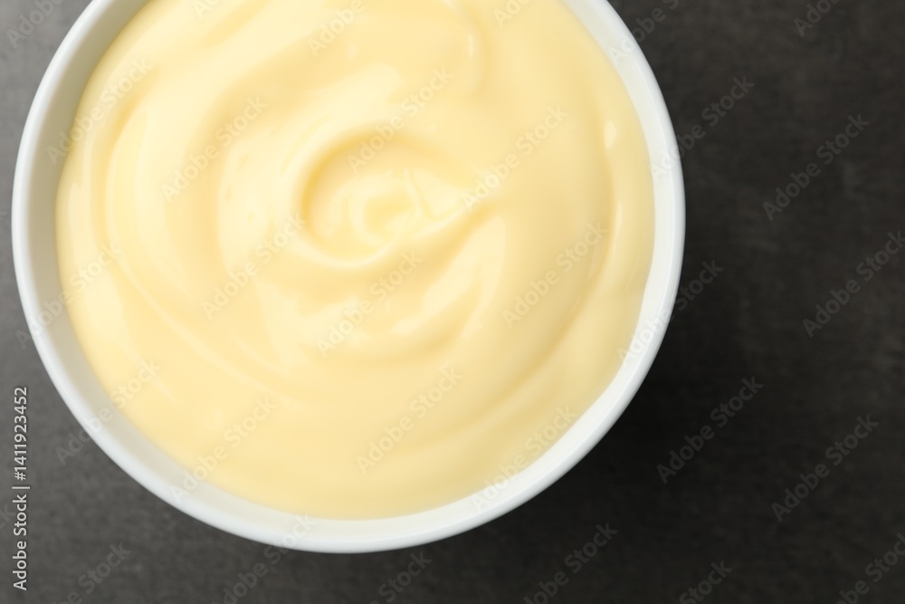 Tasty vanilla pudding on black table, top view Tasty vanilla pudding on black table, top view