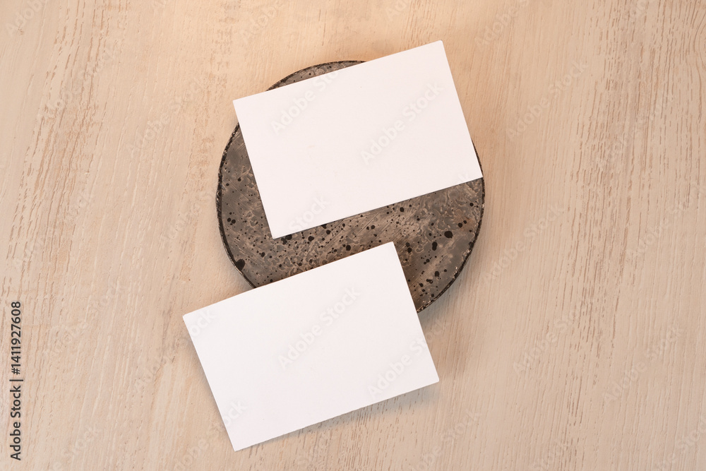White blank business card mockup with stone decoration White blank business card mockup with stone decoration