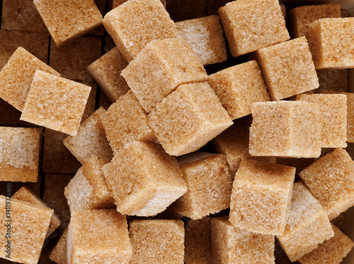 Background of brown sugar cubes. Cane brown sugar.