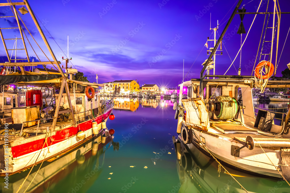 Istria, Croatia. Novigrad Istarski harbor and fishing fleet evening view