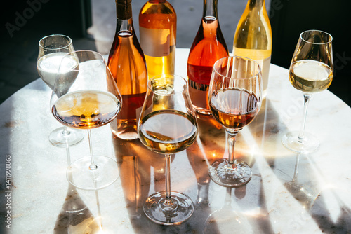 Different types of wine in glasses - red, white, rose and amber. Wine tasting in a bar or restaurant.