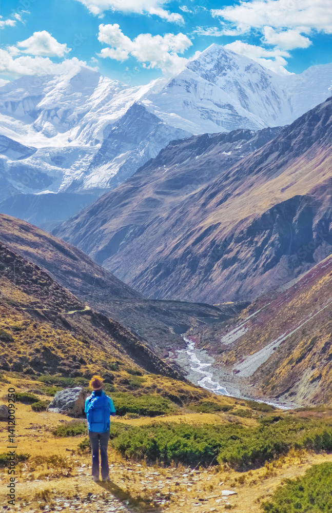 Himalayas, Nepal - The famous hiking on the roof of the world called Annapurna Circuit in the Himalaya range mountain, with little village, buddhist stupa and mountains of 8000 meters.