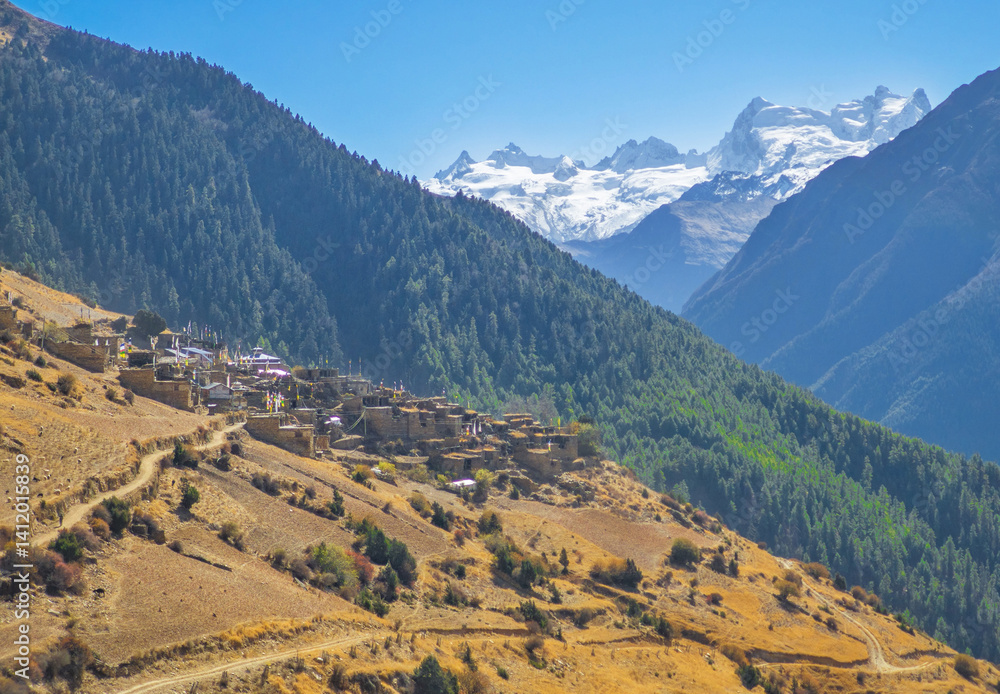 Himalayas, Nepal - The famous hiking on the roof of the world called Annapurna Circuit in the Himalaya range mountain, with little village, buddhist stupa and mountains of 8000 meters.