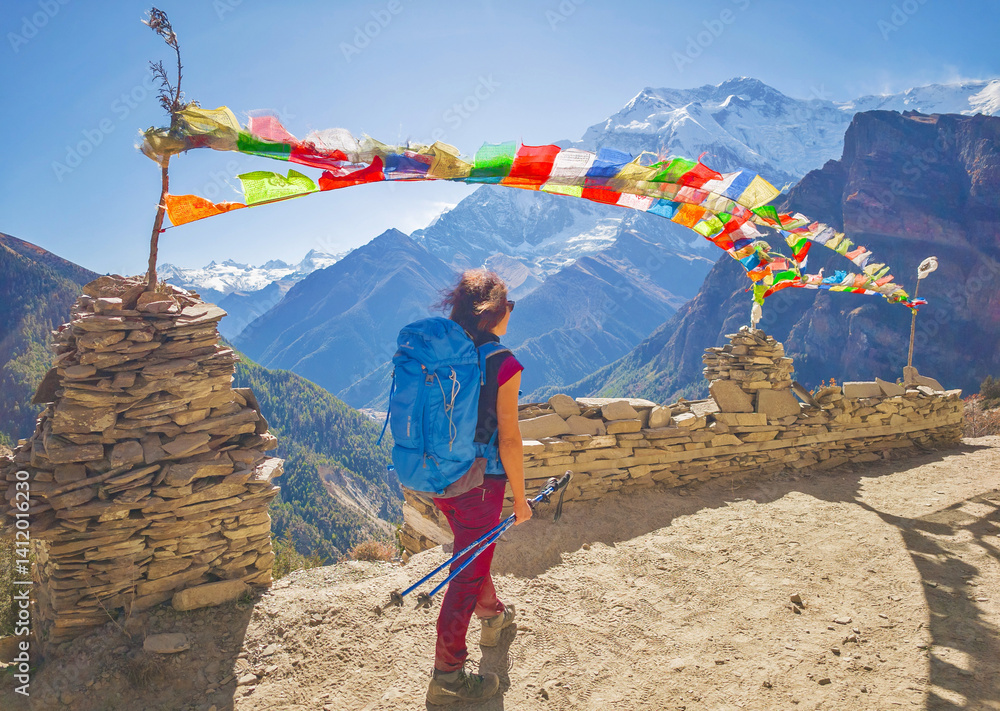 Himalayas, Nepal - The famous hiking on the roof of the world called Annapurna Circuit in the Himalaya range mountain, with little village, buddhist stupa and mountains of 8000 meters.