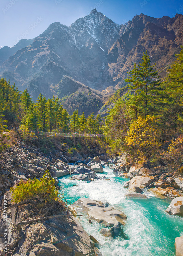 Himalayas, Nepal - The famous hiking on the roof of the world called Annapurna Circuit in the Himalaya range mountain, with little village, buddhist stupa and mountains of 8000 meters.
