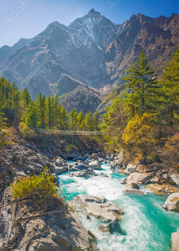 Obraz na płótnie Himalayas, Nepal - The famous hiking on the roof of the world called Annapurna Circuit in the Himalaya range mountain, with little village, buddhist stupa and mountains of 8000 meters. w salonie