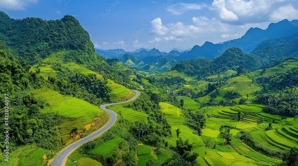 Fototapeta premium Winding road through lush valleys