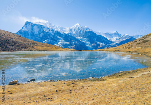 Obraz na płótnie Himalayas, Nepal - The famous hiking on the roof of the world called Annapurna Circuit in the Himalaya range mountain, with little village, buddhist stupa and mountains of 8000 meters. w salonie