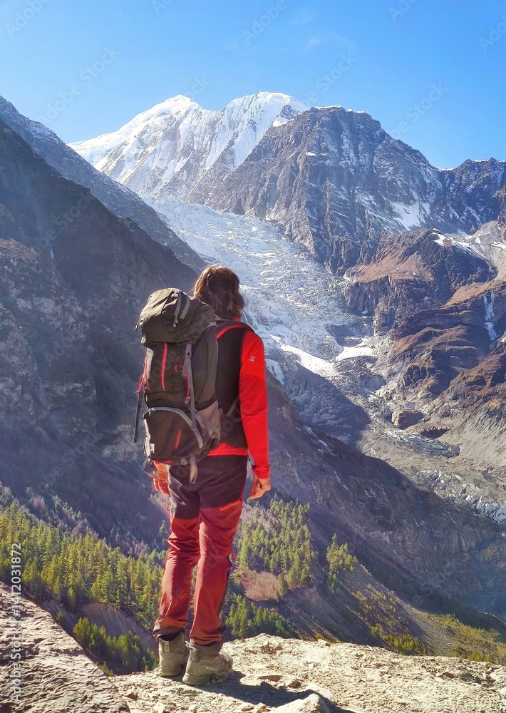Himalayas, Nepal - The famous hiking on the roof of the world called Annapurna Circuit in the Himalaya range mountain, with little village, buddhist stupa and mountains of 8000 meters.