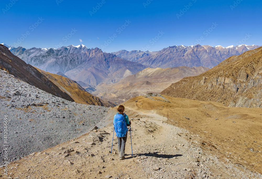 Himalayas, Nepal - The famous hiking on the roof of the world called Annapurna Circuit in the Himalaya range mountain, with little village, buddhist stupa and mountains of 8000 meters.